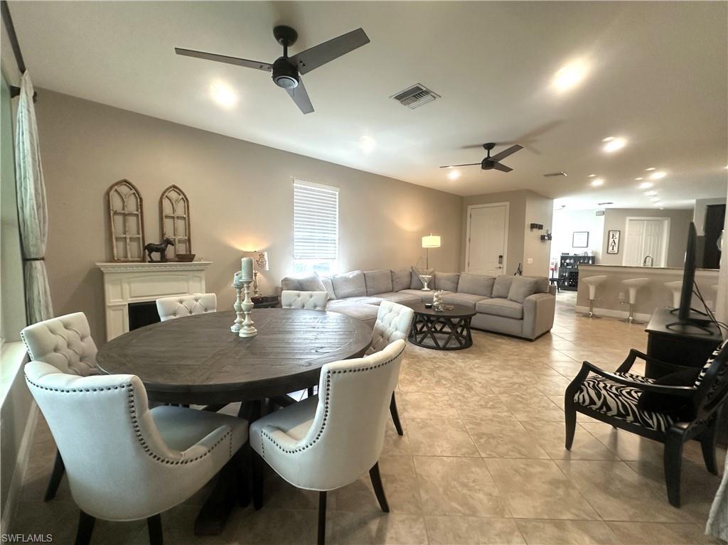 13462 Kent Street Naples, FL 34109 - Photo 7 of 30 a view of a dining room with furniture