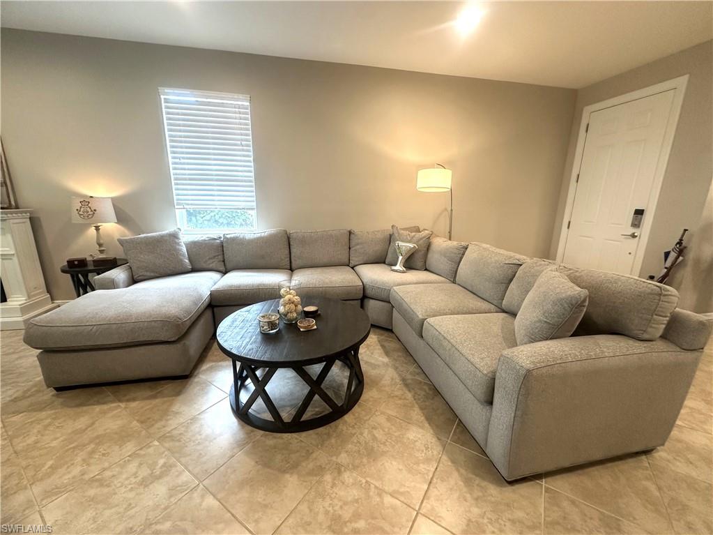 13462 Kent Street Naples, FL 34109 - Photo 10 of 30 a living room with furniture and a window