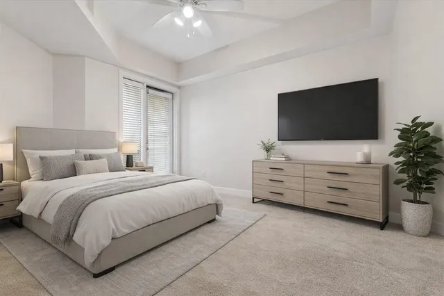 a bed room with a bed and a flat screen tv