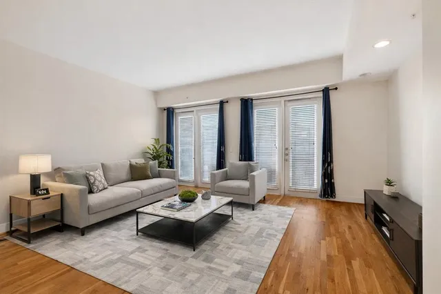 a living room with furniture and a large window
