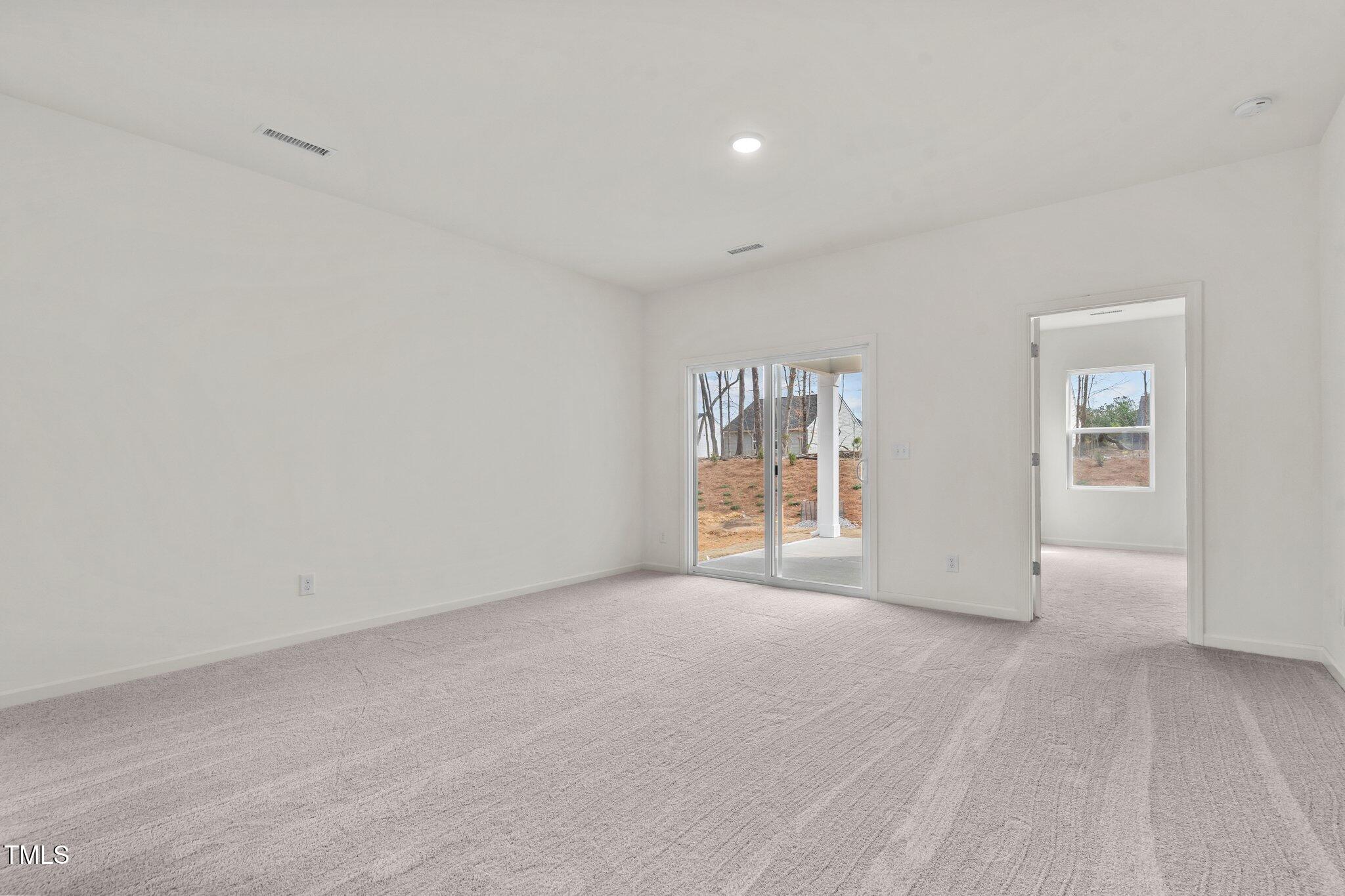 885 Embraer Way Spring Spring Hope, NC 27882 - Photo 13 of 35 an empty room with windows and closet