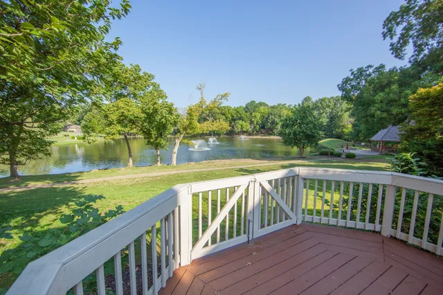 a view of a wooden deck with a yard