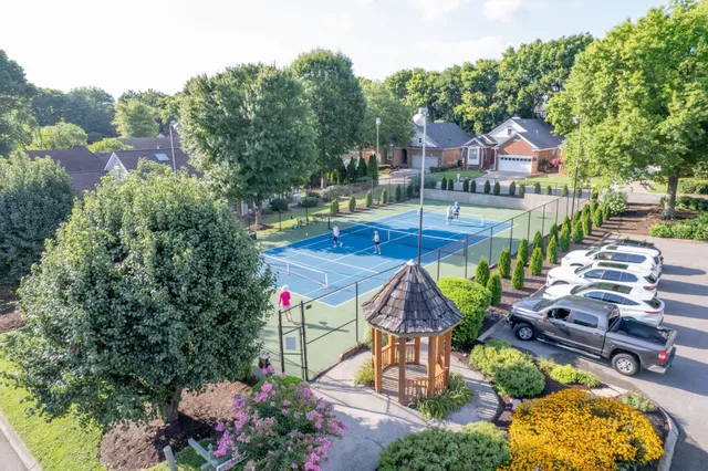 an aerial view of a house with swimming pool garden and patio