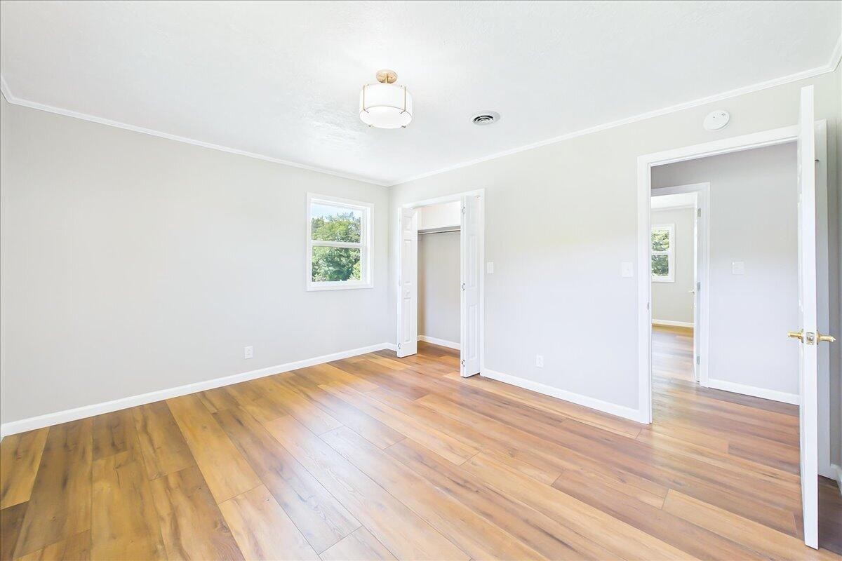 858 Main Street Decatur, TN 37322 - Photo 27 of 65 a view of an empty room with wooden floor and a window