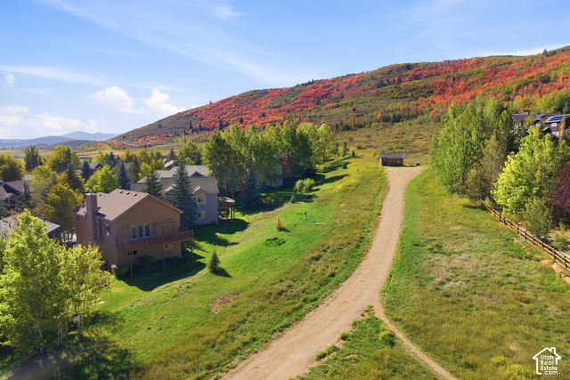 7396 Brook Hollow Loop Road Park City, UT 84098 - Photo 35 of 60 Hillside property with a natural terrain, featuring a dirt path and a small shed structure