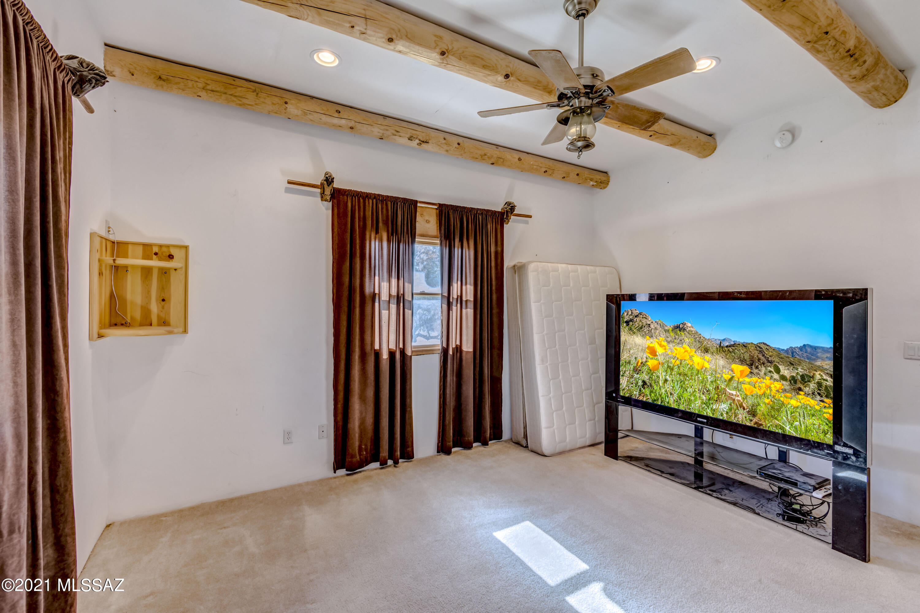 15301 East Hillton Ranch Road Vail, AZ 85641 - Photo 22 of 33 a view of a projector room with a flat screen tv