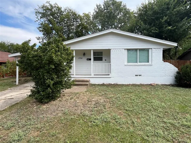a house with trees in the background