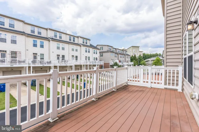 a view of a balcony with wooden floor