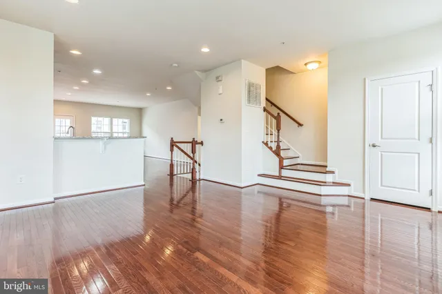 a view of an entryway with wooden floor