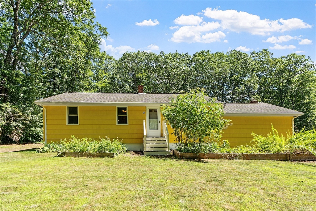 111 Wheeler Road Princeton, MA 01541 - Photo 1 of 42 a front view of a house with a yard