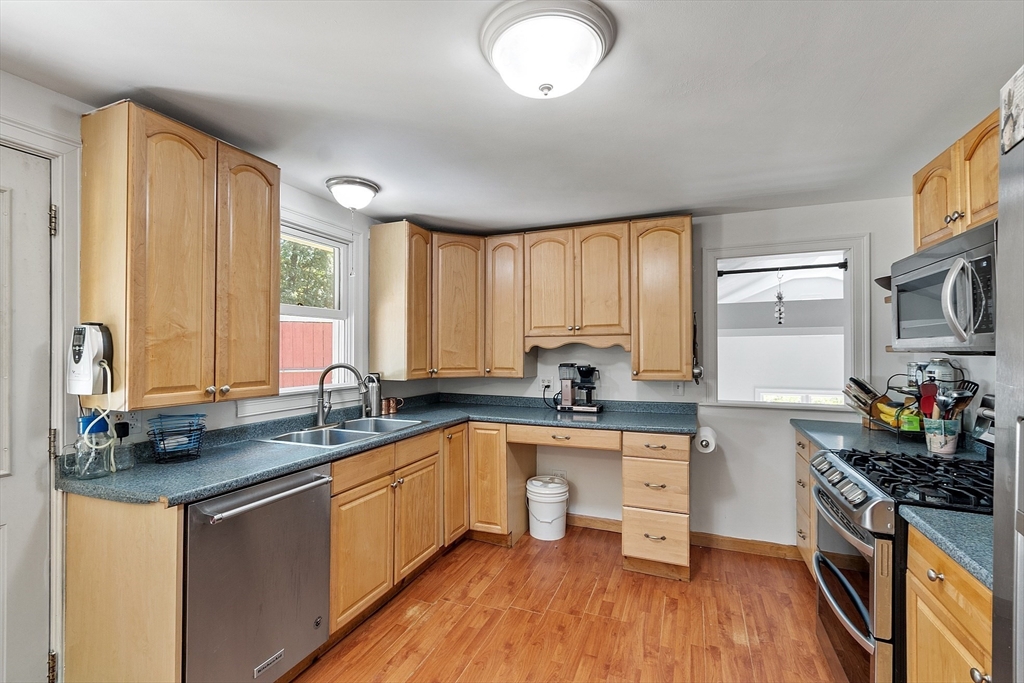111 Wheeler Road Princeton, MA 01541 - Photo 17 of 42 a kitchen with stainless steel appliances a sink cabinets and wooden floor