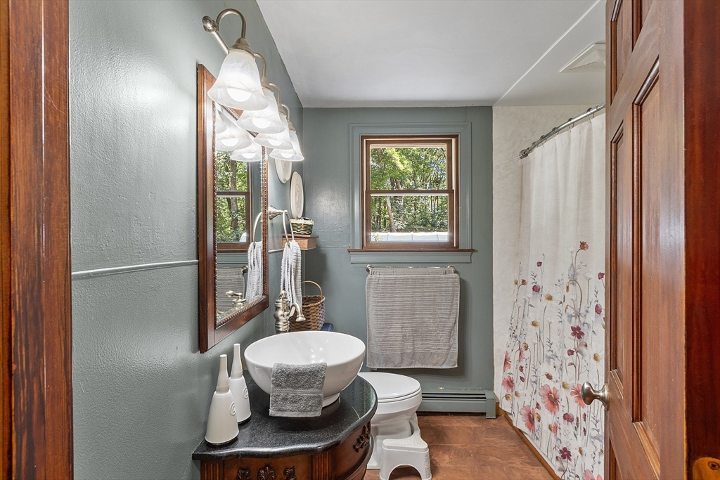 111 Wheeler Road Princeton, MA 01541 - Photo 23 of 42 a bathroom with a sink and a mirror