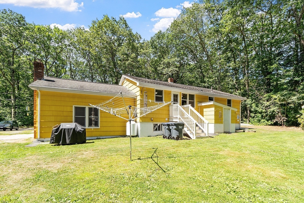 111 Wheeler Road Princeton, MA 01541 - Photo 26 of 42 a view of a house with a backyard