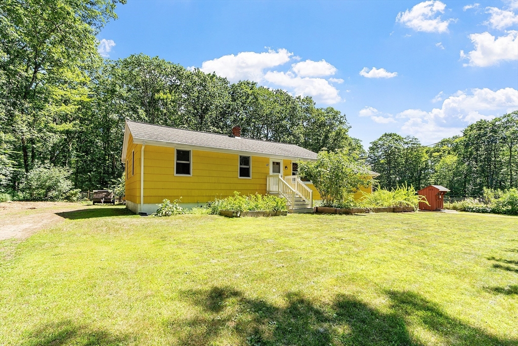 111 Wheeler Road Princeton, MA 01541 - Photo 4 of 42 a view of a house with a yard and garage