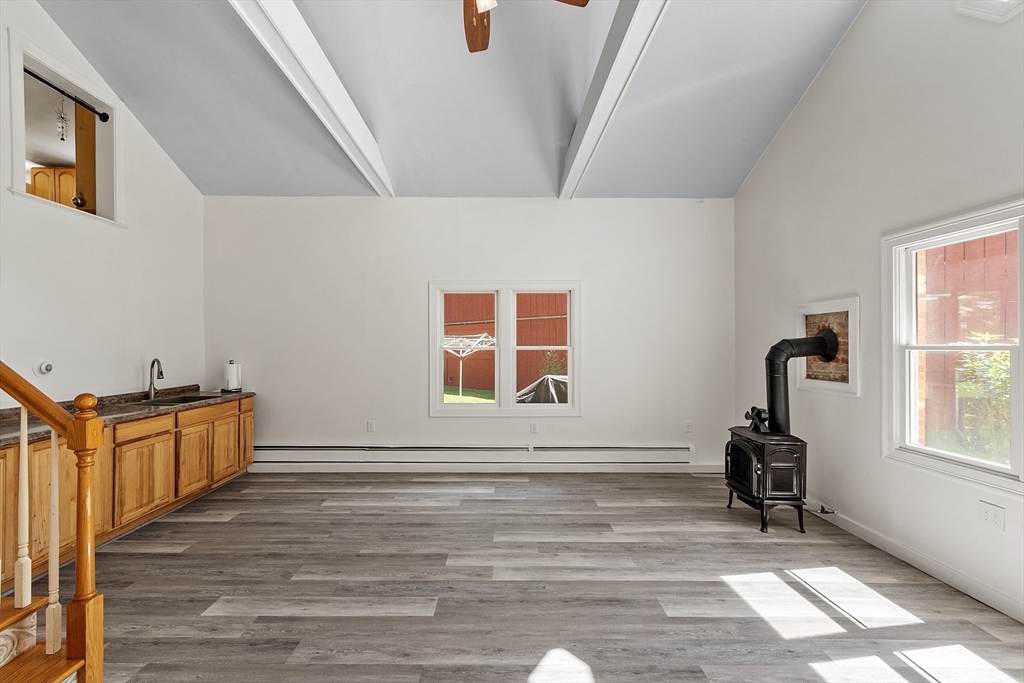 111 Wheeler Road Princeton, MA 01541 - Photo 6 of 42 a living room with wooden floor and a window
