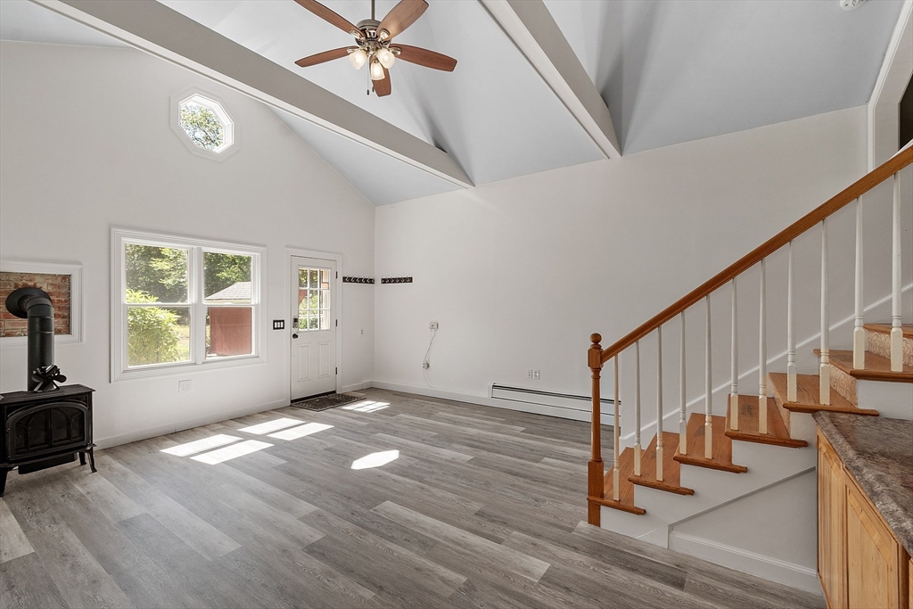 111 Wheeler Road Princeton, MA 01541 - Photo 10 of 42 a view of an empty room with wooden floor and a window