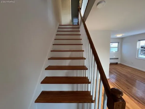 a view of entryway with wooden floor
