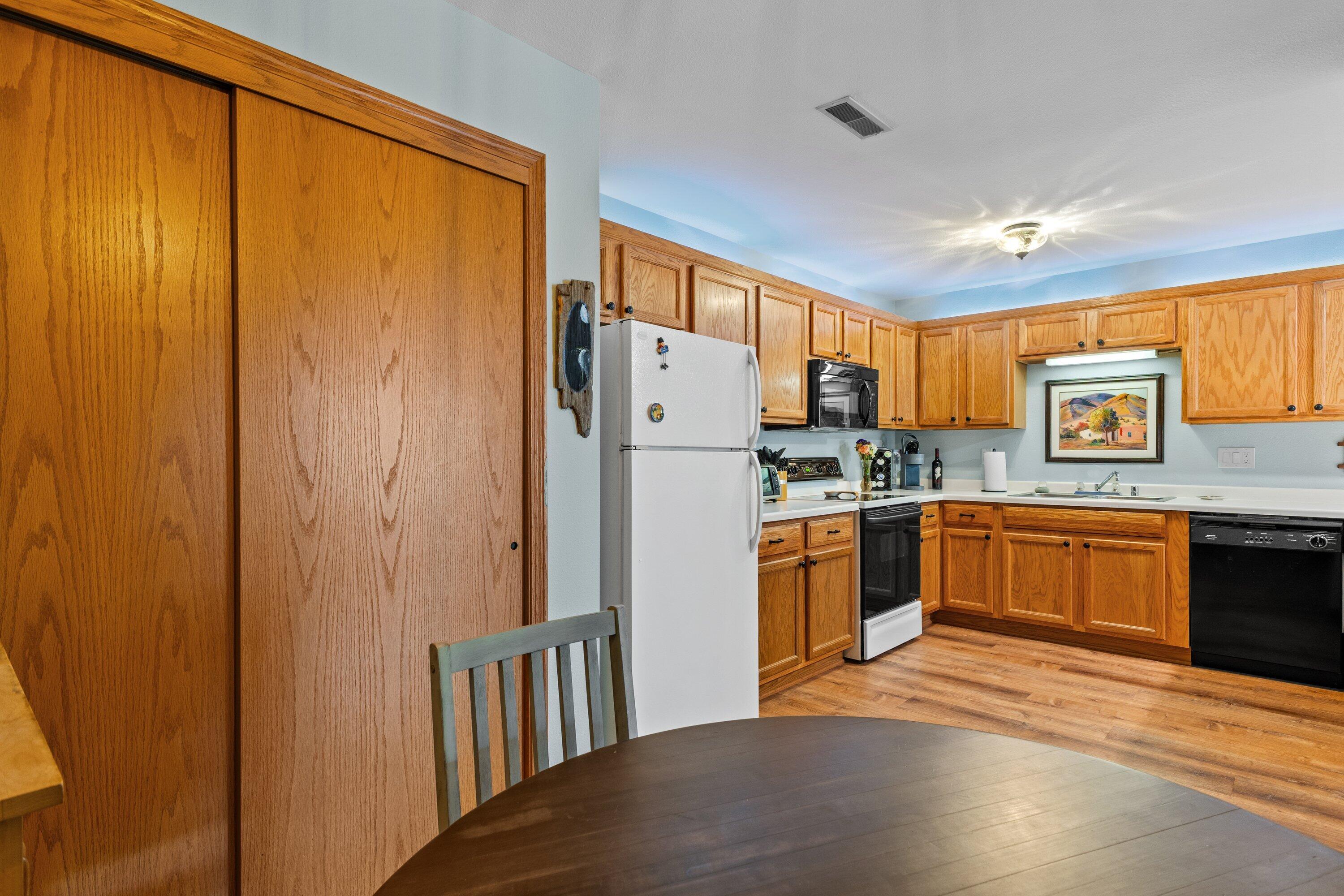 9342 West Loomis Road, Unit 8 Franklin, WI 53132 - Photo 7 of 29 view from dining into kitchen