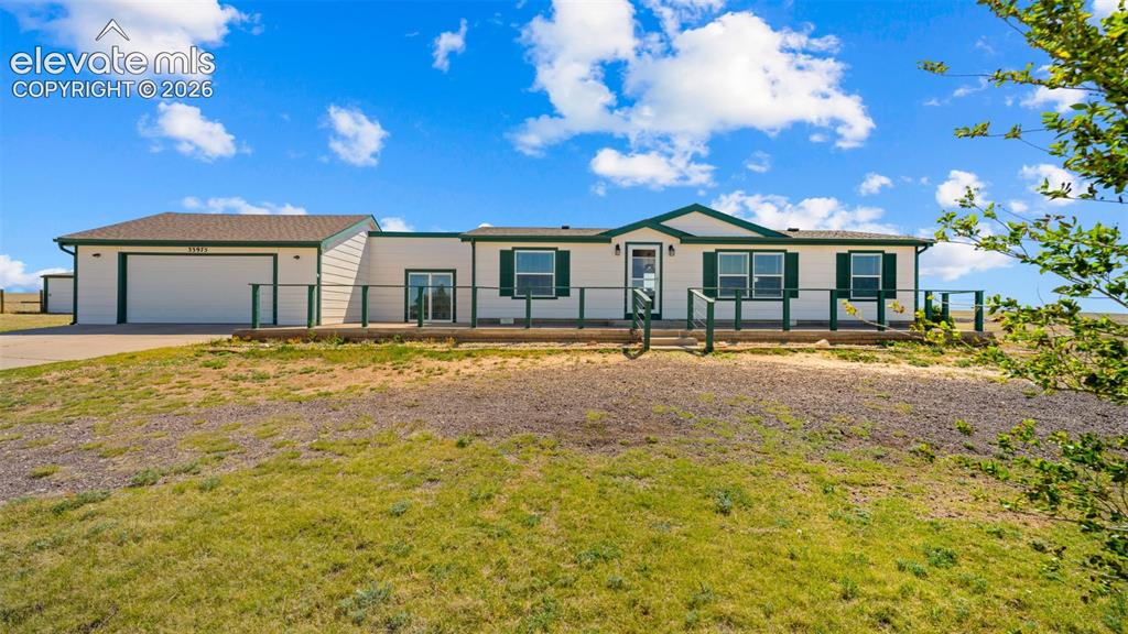 33975 Highway 94 Yoder, CO 80864 - Photo 2 of 40 Ranch-style residence featuring a prominent attached two-car garage