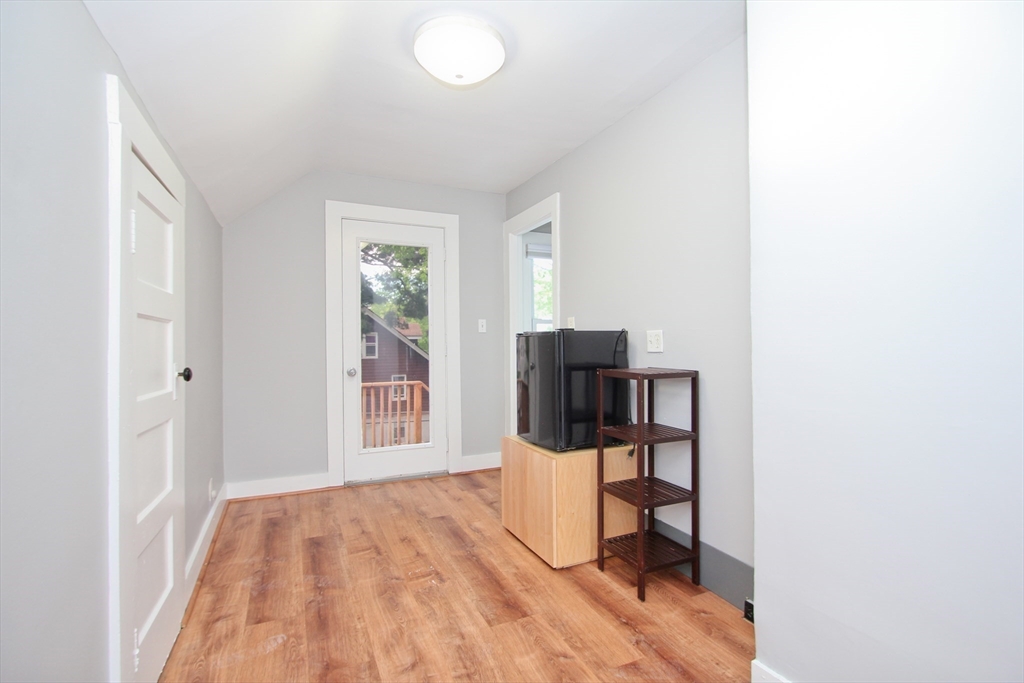 38 Virginia Street Springfield, MA 01108 - Photo 26 of 42 a view of a bedroom with a bed and tv