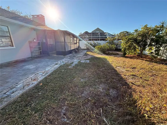 a view of a backyard of the house