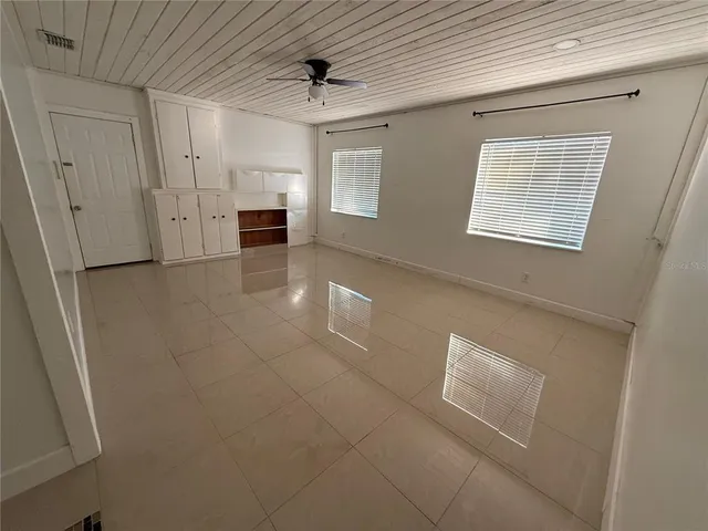 a view of empty room with a fireplace