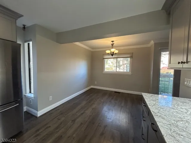 a kitchen with a sink stainless steel appliances and cabinets