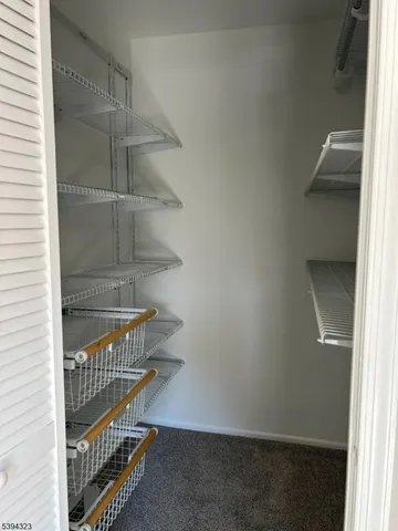 a view of entryway with a small yard