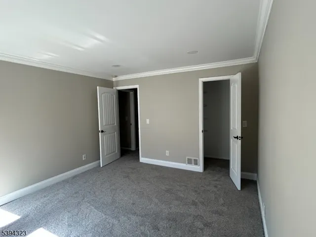 a bathroom with a granite countertop sink toilet and a mirror
