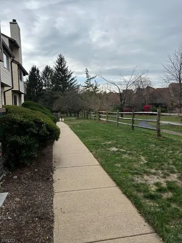 an empty room with wooden floor and fireplace