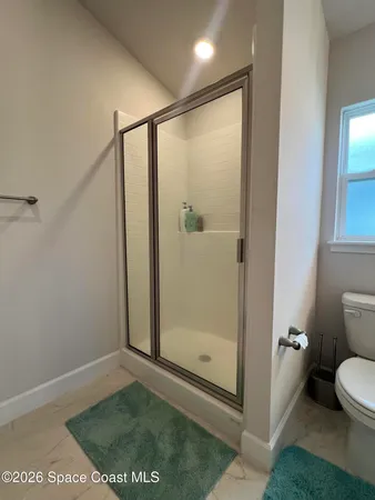 an empty room with a view of a bathroom