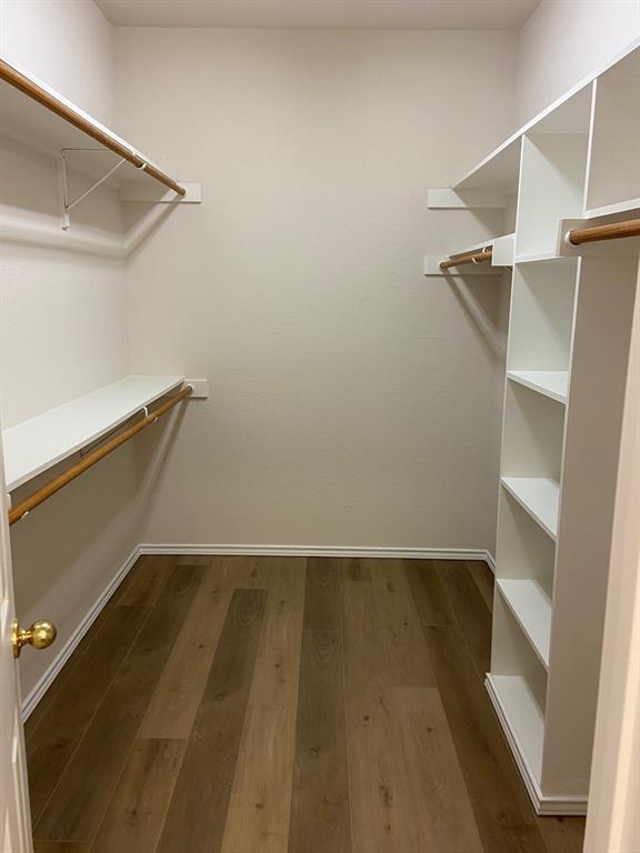 27101 Meadowmore Court Whitney, TX 76692 - Photo 18 of 32 Large walk in master closet with custom shelving.
