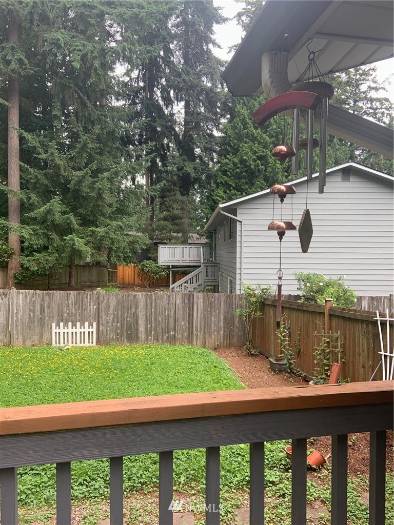 3302 198th Place Southeast Bothell, WA 98012 - Photo 17 of 19 a backyard of a house with wooden floor