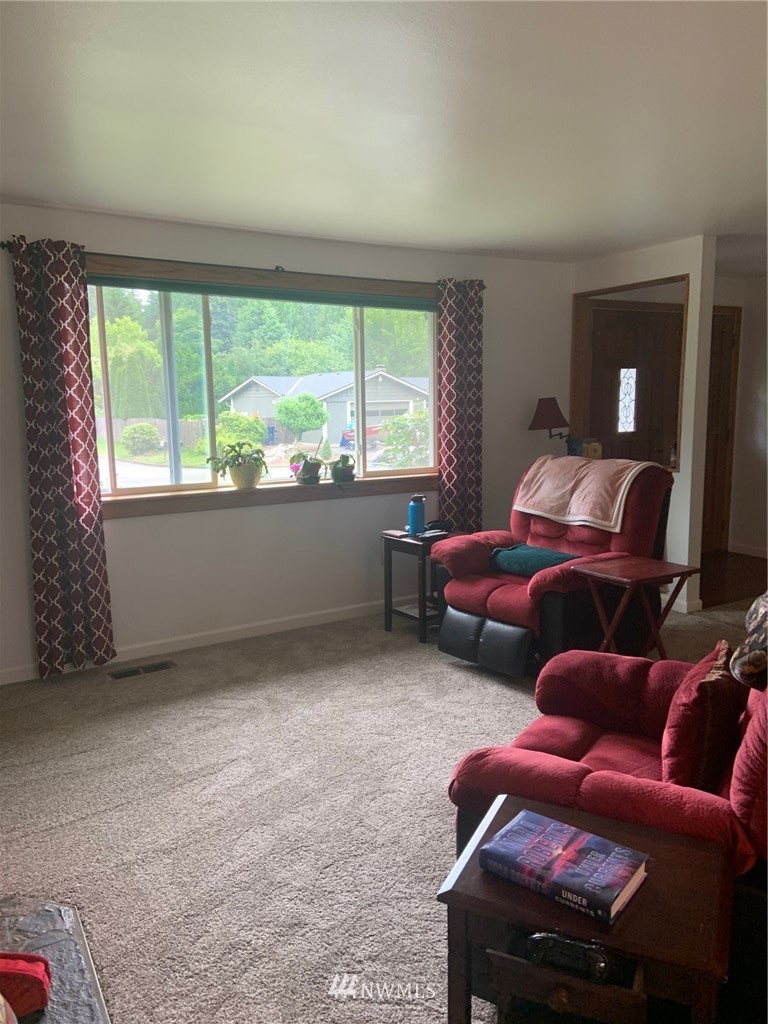 3302 198th Place Southeast Bothell, WA 98012 - Photo 4 of 19 a living room with furniture and a window