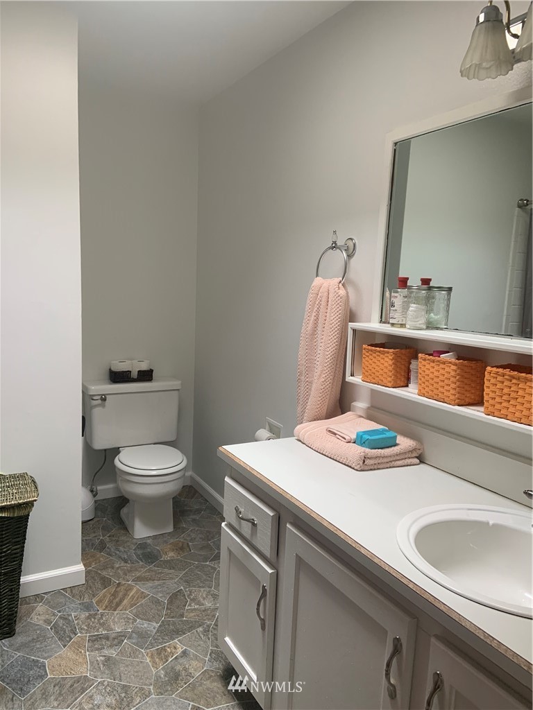 3302 198th Place Southeast Bothell, WA 98012 - Photo 10 of 19 a bathroom with a sink and a toilet
