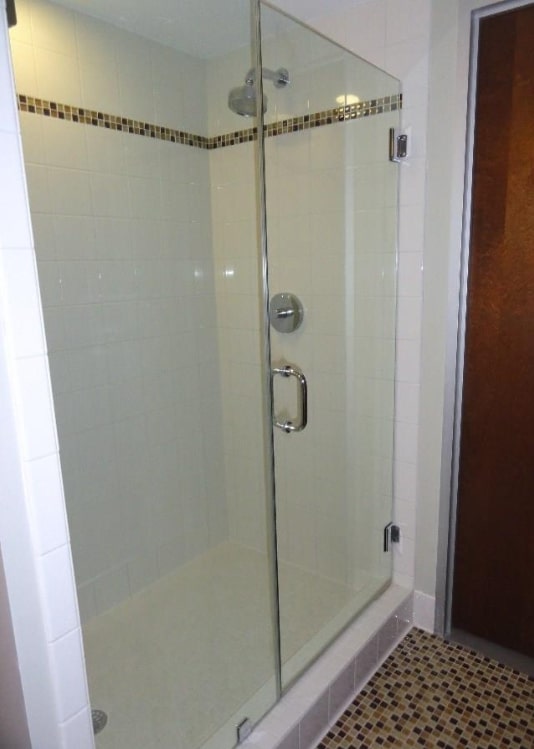 800 Brazos Street, Unit 1006 Austin, TX 78701 - Photo 11 of 26 a bathroom with a glass shower door