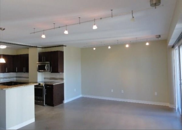 800 Brazos Street, Unit 1006 Austin, TX 78701 - Photo 4 of 26 a view of cabinets a sink and a stove in a room