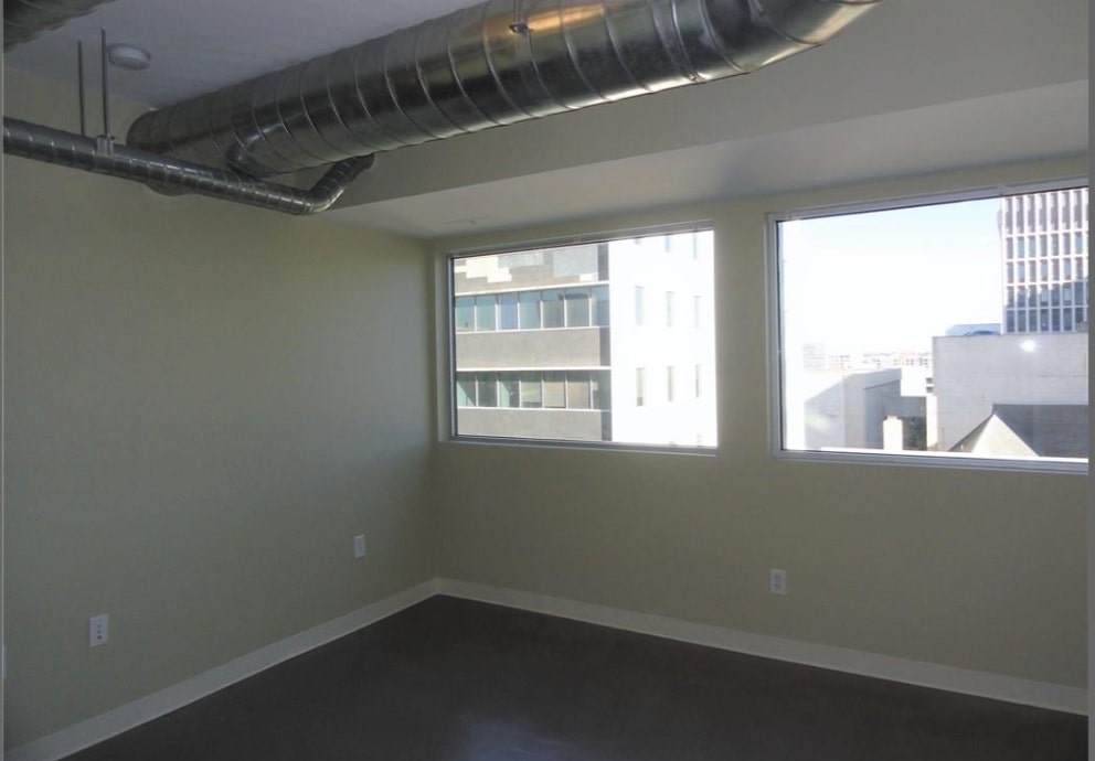 800 Brazos Street, Unit 1006 Austin, TX 78701 - Photo 9 of 26 a view of a small space with wooden floor and a window