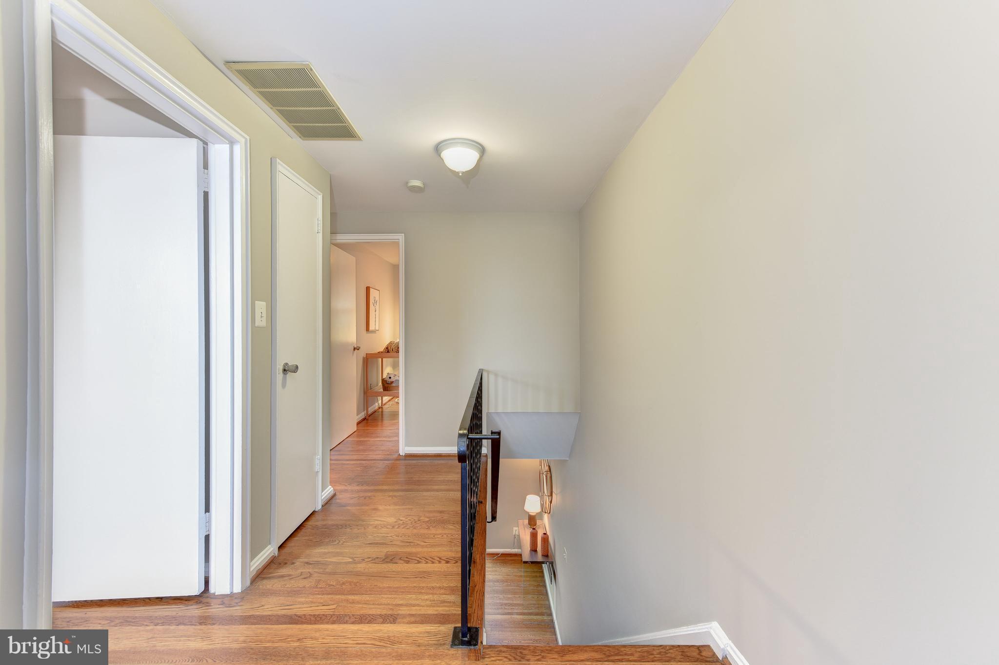 2918 Hickory Street Alexandria, VA 22305 - Photo 15 of 30 a view of a hallway with wooden floor and staircase