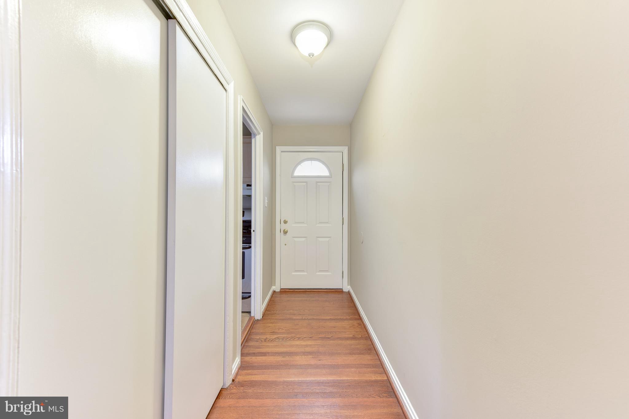 2918 Hickory Street Alexandria, VA 22305 - Photo 3 of 30 a view of a hallway with wooden floor