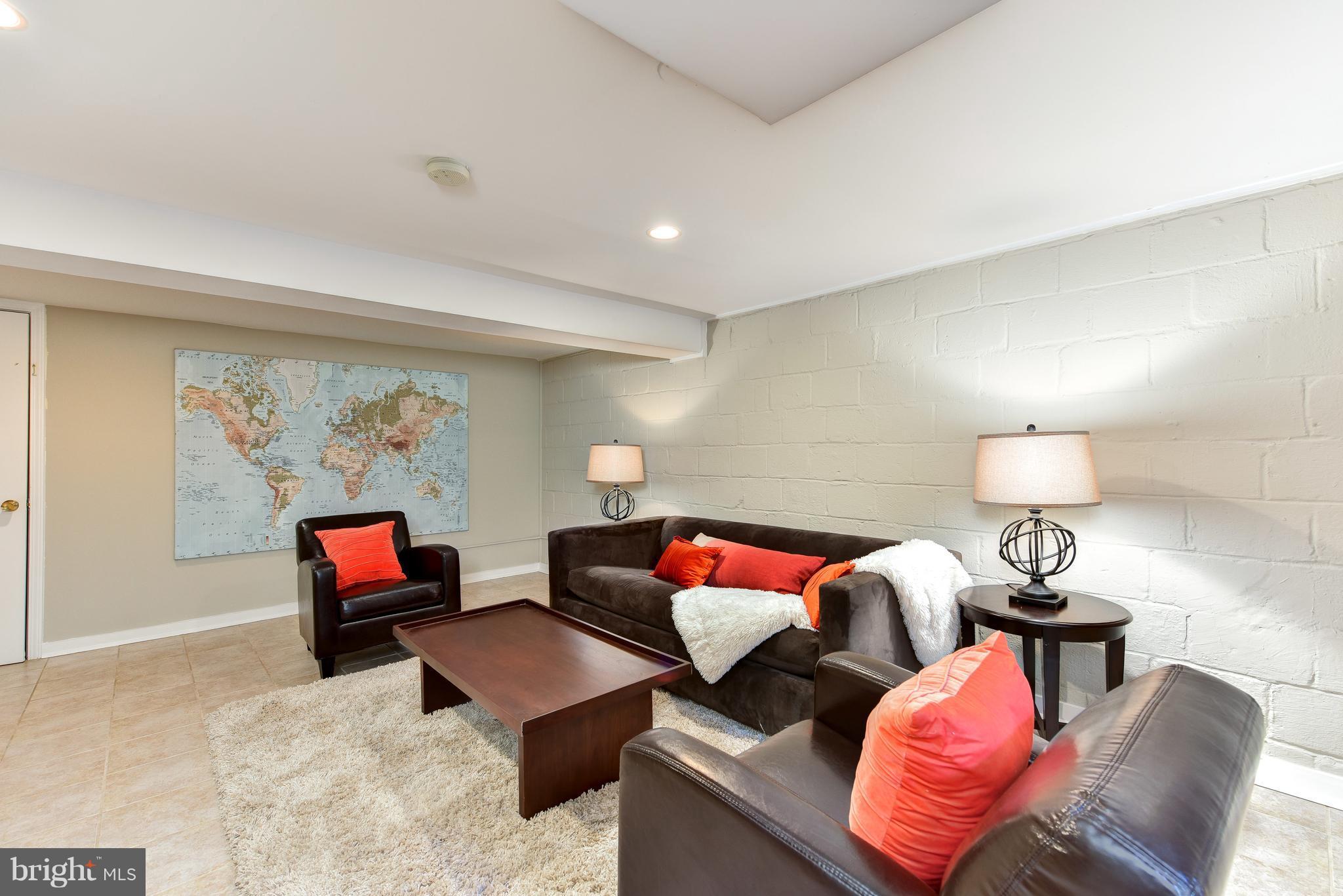 2918 Hickory Street Alexandria, VA 22305 - Photo 24 of 30 a living room with furniture and a flat screen tv