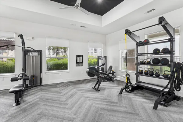 a view of a livingroom with workspace and a window