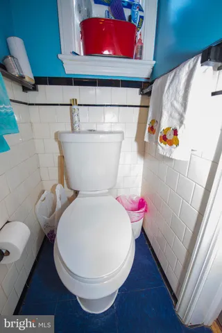 a bathroom with a toilet sink and shower