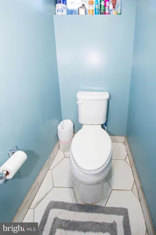 a front view of a house with sitting area