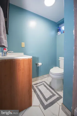 a view of a patio with table and chairs with wooden fence and floor