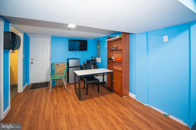 a view of a yard with snow on the road