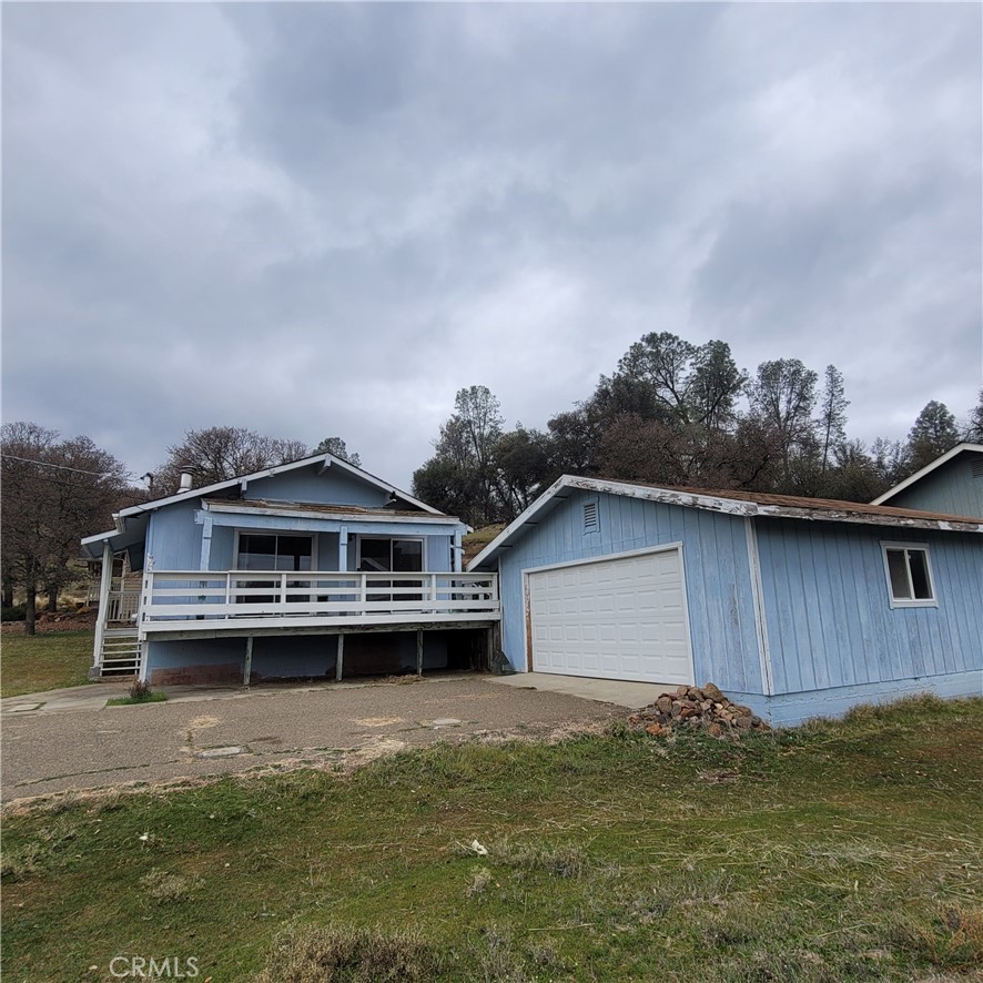 20457 Powder Horn Road Hidden Valley Lake, CA 95467 - Photo 1 of 1 a house with river in front of it