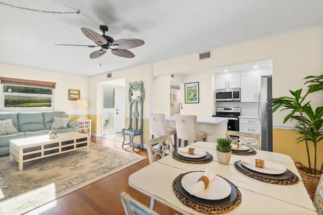 a kitchen with a table and chairs in it