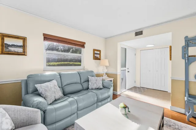 a view of a bedroom with bed and closet