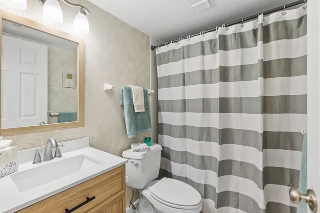 a view of a porch with furniture and garden